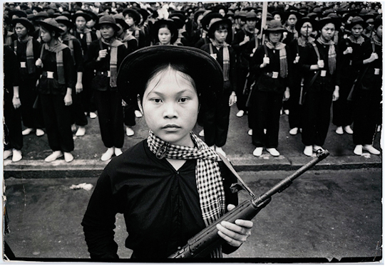 "A brigade of Vietcong women soldiers in gala-uniform stand in formation with Type 56 rifles during a victory parade. Vietnam, no date / Bollinger." (C) Black Star Publishing Co. Inc.